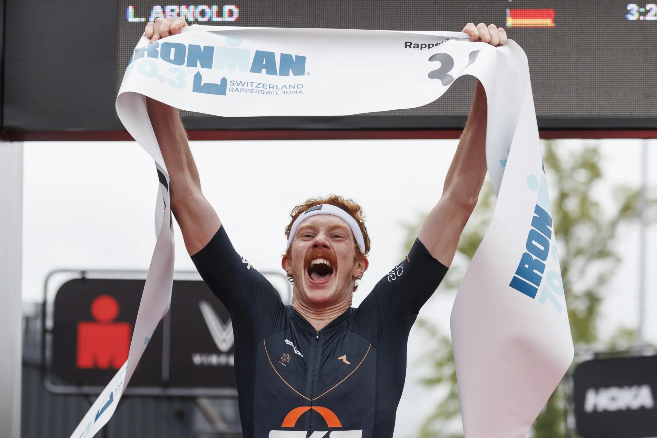 RAPPERSWIL, SWITZERLAND - JUNE 02: Leonard Arnold of Germany reacts after crossing the finish line first during the 2024 IRONMAN 70.3 Switzerland on June 02, 2024 in Rapperswil, Switzerland. (Photo by Jan Hetfleisch/Getty Images for IRONMAN )