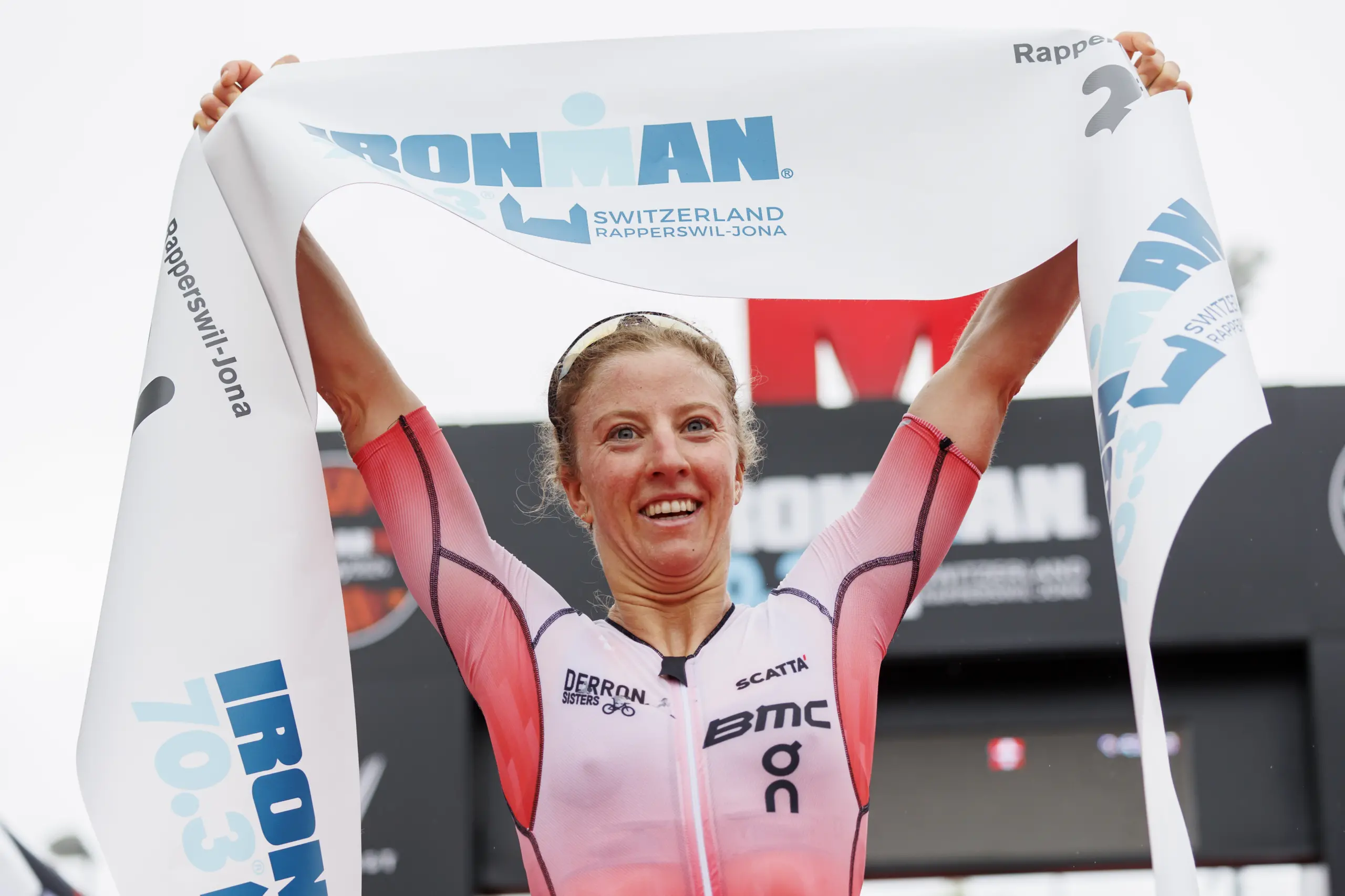 RAPPERSWIL, SWITZERLAND - JUNE 02: Julie Derron of Switzerland reacts after crossing the finisch line first during the 2024 IRONMAN 70.3 Switzerland on June 02, 2024 in Rapperswil, Switzerland. (Photo by Jan Hetfleisch/Getty Images for IRONMAN )
