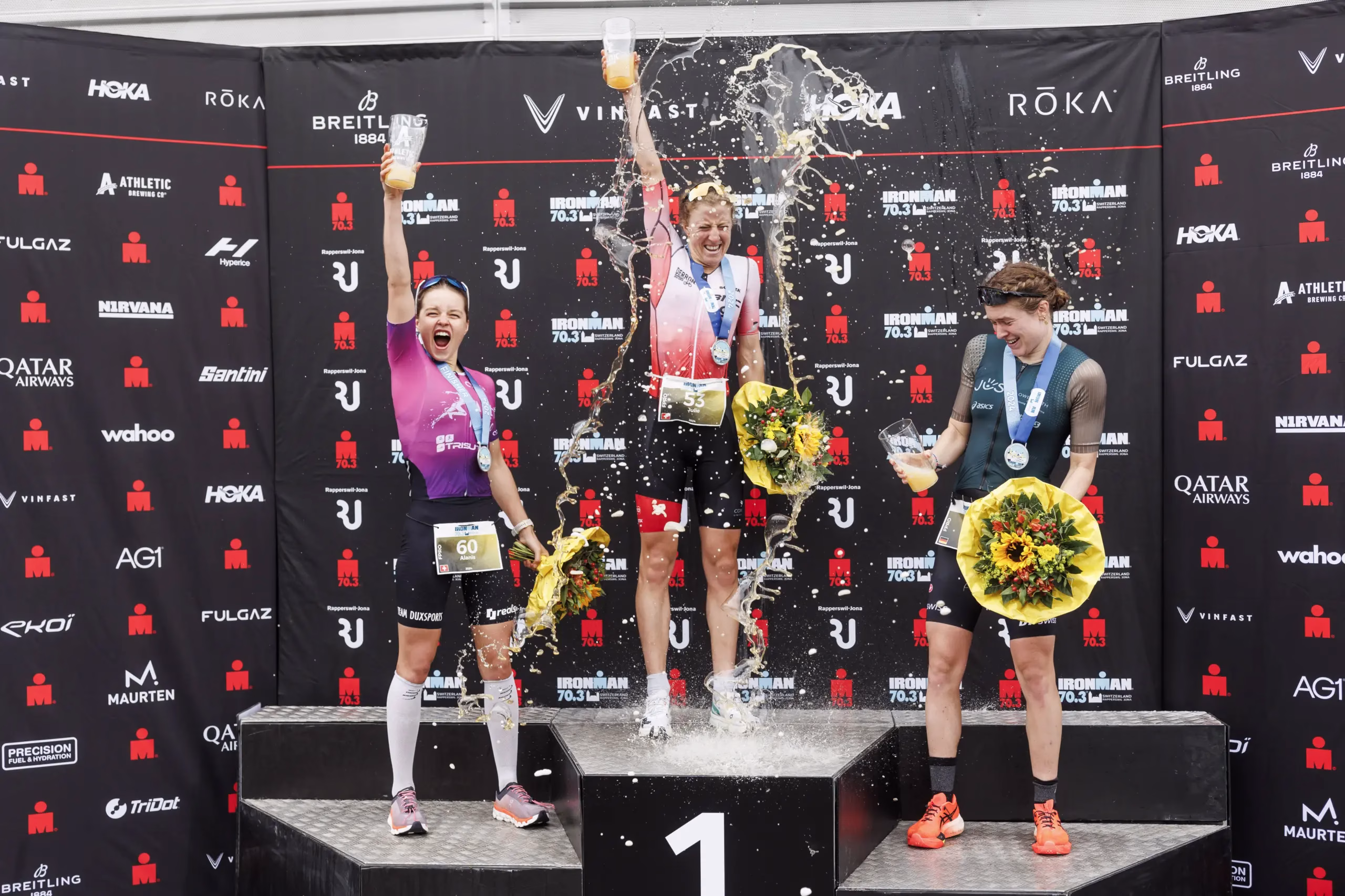 RAPPERSWIL, SWITZERLAND - JUNE 02: (L-R) Alanis Siffert of Switzerland, Julie Derron of Switzerland and Lena Meissner of Germany pose for a picture during the flower ceremony during the 2024 IRONMAN 70.3 Switzerland on June 02, 2024 in Rapperswil, Switzerland. (Photo by Jan Hetfleisch/Getty Images for IRONMAN )